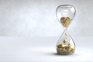 gold-coin-hourglass-time-is-money-concept